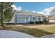 Exterior view of the home showing the siding, lawn, and landscaping at 12638 James Pt, Broomfield, CO 80020