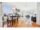 Spacious and bright living area features hardwood flooring, large windows and an adjacent dining area at 12638 James Pt, Broomfield, CO 80020