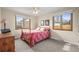 Bright bedroom features two windows and a ceiling fan at 6151 W Evans Pl, Lakewood, CO 80227