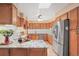 Well-equipped kitchen featuring stainless steel appliances and ample counter space at 6151 W Evans Pl, Lakewood, CO 80227