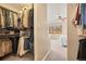 Spacious walk-in closet with ample hanging space and convenient access to the bedroom at 6151 W Evans Pl, Lakewood, CO 80227