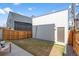 Spacious backyard with a small grassy area and new fence, ideal for pets or outdoor activities at 3275 Lawrence St, Denver, CO 80205