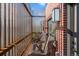 Private balcony with cozy wicker chairs, providing a relaxing outdoor space to enjoy the surrounding view at 3275 Lawrence St, Denver, CO 80205