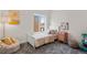 Bright bedroom with a cozy beanbag, playful decor, and ample natural light at 3275 Lawrence St, Denver, CO 80205