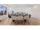 Spacious dining room featuring hardwood floors, a long dining table, and contemporary decor at 3275 Lawrence St, Denver, CO 80205