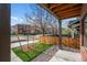 Charming covered porch with a view of the street and neighborhood homes at 3275 Lawrence St, Denver, CO 80205