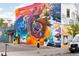 Large, vibrant mural on the side of a building adding an artistic element to the urban landscape at 3275 Lawrence St, Denver, CO 80205