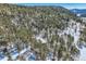 Secluded home surrounded by dense forest, offering privacy and scenic views at 21191 Pleasant Park Rd, Conifer, CO 80433
