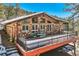 Charming stone-clad home with a large deck, perfect for enjoying the mountain views at 21191 Pleasant Park Rd, Conifer, CO 80433