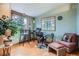 Office featuring hardwood floors, and views of the surrounding trees through the windows at 21191 Pleasant Park Rd, Conifer, CO 80433