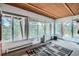 Bright sunroom with expansive windows offering panoramic views of the surrounding nature at 21191 Pleasant Park Rd, Conifer, CO 80433
