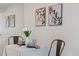 Cozy dining area featuring art and a table setting at 9222 E Arbor Cir # L, Englewood, CO 80111