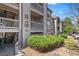 Exterior view of the apartment building with well-maintained landscaping and reserved parking at 9222 E Arbor Cir # L, Englewood, CO 80111