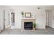Tiled fireplace with mantel in a cozy living room setting at 9222 E Arbor Cir # L, Englewood, CO 80111