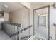 Hallway leading to a condo door with a neutral color scheme at 9222 E Arbor Cir # L, Englewood, CO 80111