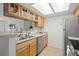 Bright kitchen with stainless appliances and modern lighting at 9222 E Arbor Cir # L, Englewood, CO 80111