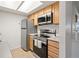 Modern kitchen with stainless steel appliances and ample counter space at 9222 E Arbor Cir # L, Englewood, CO 80111