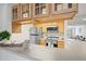 Kitchen with stainless steel appliances and wooden cabinets at 9222 E Arbor Cir # L, Englewood, CO 80111