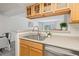 Open kitchen sink area with view to other living spaces at 9222 E Arbor Cir # L, Englewood, CO 80111