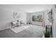 Bright living room featuring neutral walls and view from the window at 9222 E Arbor Cir # L, Englewood, CO 80111