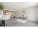 Bright living room with carpet, neutral walls, and an open layout at 9222 E Arbor Cir # L, Englewood, CO 80111