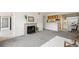 Bright living room featuring carpet, neutral walls, and fireplace at 9222 E Arbor Cir # L, Englewood, CO 80111