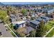 Aerial view showing the home's location in a vibrant neighborhood with a skyline in the background at 2090 Irving St, Denver, CO 80211