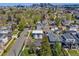 Scenic aerial view of the neighborhood with lush greenery and city skyline, showcasing the home's prime location at 2090 Irving St, Denver, CO 80211