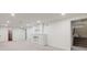 Spacious basement with fireplace, neutral carpet, and ample natural light at 2090 Irving St, Denver, CO 80211
