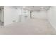 Spacious basement with new carpet and a charming painted brick fireplace at 2090 Irving St, Denver, CO 80211
