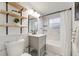 Modern bathroom features marble tile, floating shelves, and updated fixtures at 2090 Irving St, Denver, CO 80211