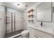 Updated bathroom featuring a stand-up shower and modern vanity with shelves at 2090 Irving St, Denver, CO 80211