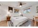 Inviting bedroom with wood floors, ceiling fan, and two windows with natural light at 2090 Irving St, Denver, CO 80211
