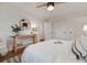 Inviting bedroom with wood floors, ceiling fan, and two windows with natural light at 2090 Irving St, Denver, CO 80211