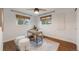 Bright bedroom or office with hardwood floors, large windows, and modern decor at 2090 Irving St, Denver, CO 80211