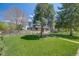 Well-manicured front yard with lush green grass and a sidewalk leading to the charming brick facade home at 2090 Irving St, Denver, CO 80211