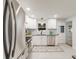 Modern, bright kitchen with white cabinets, stainless steel appliances, and subway tile backsplash at 2090 Irving St, Denver, CO 80211