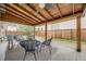 A covered patio with comfortable seating arrangement and a ceiling fan at 2090 Irving St, Denver, CO 80211