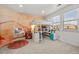 bedroom with a built-in bunk bed, modern mural, and a hanging chair by the window at 10795 Sundial Rim Rd, Highlands Ranch, CO 80126