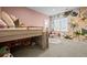 bedroom with a built-in bunk bed, modern wallpaper, and a hanging chair by the window at 10795 Sundial Rim Rd, Highlands Ranch, CO 80126