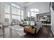 Open-concept living area with vaulted ceilings, abundant natural light, and seamless flow to dining space at 10795 Sundial Rim Rd, Highlands Ranch, CO 80126