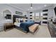 Spacious primary bedroom boasts a plush bed, stylish decor, and ample natural light from the window at 10795 Sundial Rim Rd, Highlands Ranch, CO 80126
