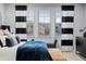 A view of the primary bedroom featuring designer curtains, a plush bed, and ample natural light from the window at 10795 Sundial Rim Rd, Highlands Ranch, CO 80126
