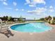 Community pool area with comfortable seating, offering residents a relaxing and refreshing recreational option at 10795 Sundial Rim Rd, Highlands Ranch, CO 80126