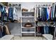 Organized walk-in closet with ample shelving, hanging space, and dedicated shoe racks for optimal storage at 10795 Sundial Rim Rd, Highlands Ranch, CO 80126