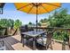 Cozy outdoor deck with umbrella, seating and grill, ideal for entertaining and relaxing at 10442 Hyacinth St, Highlands Ranch, CO 80129