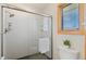 Clean, newly renovated shower in a bathroom featuring a glass enclosure and modern fixtures at 1430 S Lima St, Aurora, CO 80012