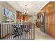 Charming kitchen features wood cabinets, stainless steel appliances, tile backsplash, and a window view at 1430 S Lima St, Aurora, CO 80012