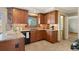 Kitchen with tile floors, under cabinet lighting, stone countertops, and stainless steel appliances at 1430 S Lima St, Aurora, CO 80012