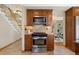 Functional kitchen with stainless steel range, built-in microwave, and tiled backsplash at 1430 S Lima St, Aurora, CO 80012